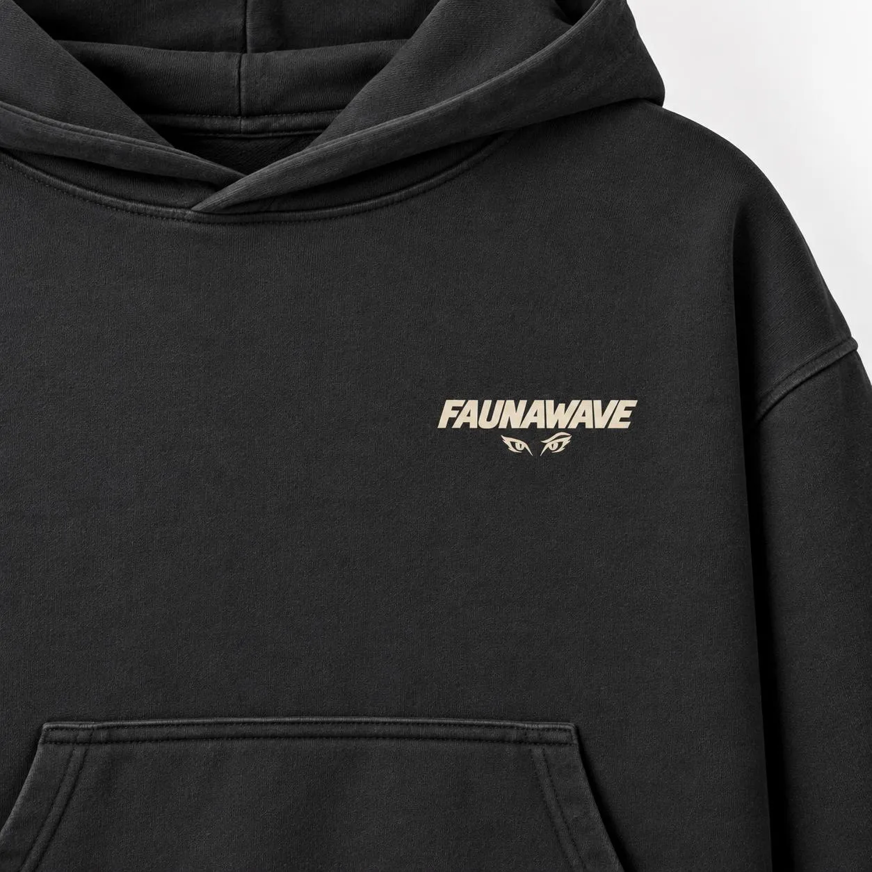 Close-up of the small Faunawave logo on the fox hoodie (illustrative mockup)
